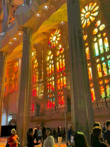 Coloured stained-glass light filling the interior of the Sagrada Família