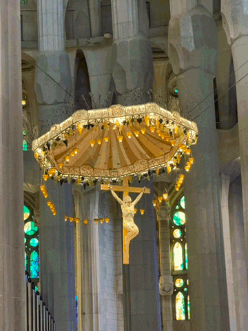 Suspended crucifix over the altar inside the Sagrada Família