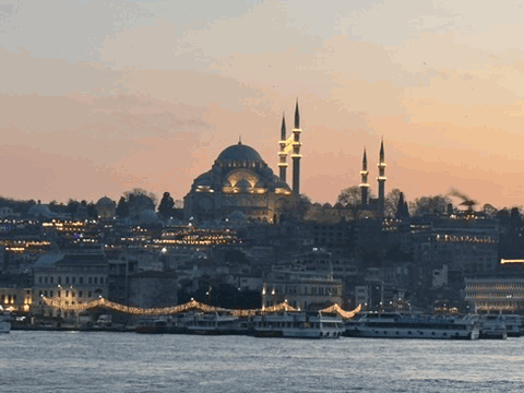 Istanbul domes and minarets across the water at dusk